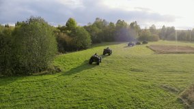People riding on quad bikes, aerial view. Clip. Tourists driving quad bikes through forest, active lifestyle and travelling concept.