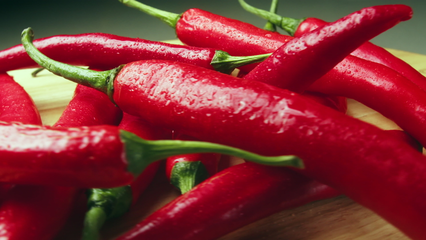 Ripe red hot chili peppers are a culinary delight and the number one cash crop in New Mexico, USA. They are a delicious part of Mexican food in the southwest. Left to right 4K close-up slider video.