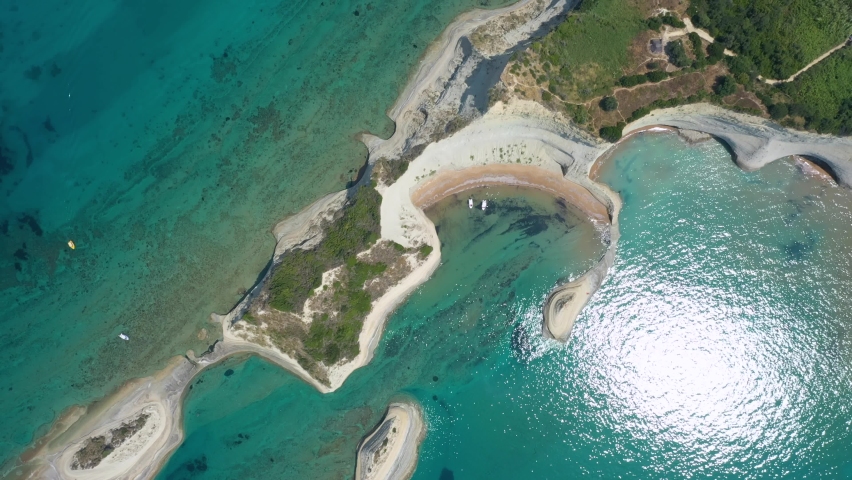 Aerial view of sheer white cliffs of Cape Drastis near Peroulades village on Corfu Island in Greece
 | Shutterstock HD Video #1093129809