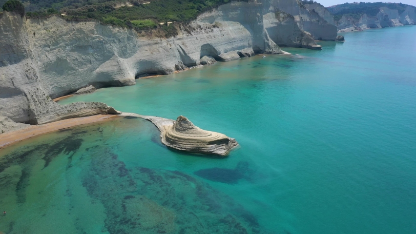 Aerial view of sheer white cliffs of Cape Drastis near Peroulades village on Corfu Island in Greece
 | Shutterstock HD Video #1093129811