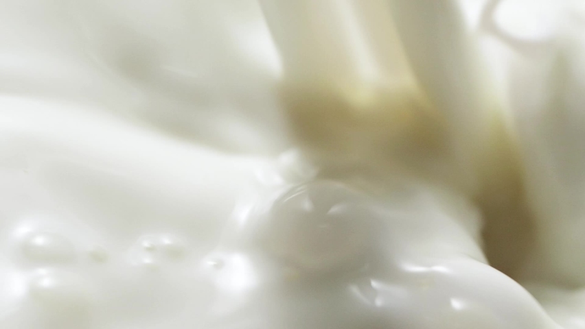 Macro slow motion pouring white milk, closeup splashing fresh drink with bubbles | Shutterstock HD Video #1093134115