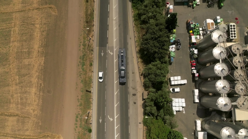 Tow truck carrying a single car on a rural highway, Aerial follow footage. | Shutterstock HD Video #1093134273