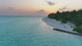 Beautiful drone video of sunset on the island, Maldives at sunset, beautiful island and beach with blue water