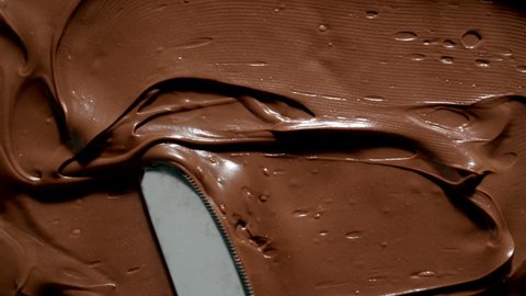 TOP VIEW: Knife spreads a chocolate paste Adlı Stok Video