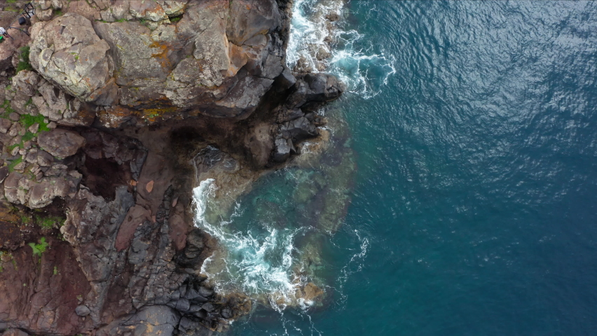 4K footage of Atlantic ocean tranquil waves surf washing  Sao Lourenco bay cliffs  - the headland's eastern point on volcanic Madeira island, Portugal. | Shutterstock HD Video #1093148713