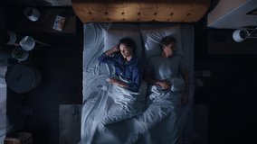 Top View Apartment: Happy Young Couple Side Cuddling Together in the Bed Sleeping at Night. Beautiful Girlfriend and Handsome Boyfriend Sleeping Together. Family of two Sweetly Embracing, Spooning - Powered by Shutterstock - Get 15% off with code: PIKWIZARD15