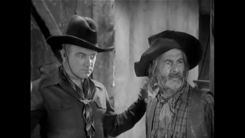 CIRCA 1937 - In this western film, a little girl says an emotional goodbye to Hopalong Cassidy after he's surrendered to an outlaw to keep her safe.