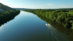  Aerial video footage of an inflatable boat floating on the river. Beautiful landscape. Drone video 4k footage.