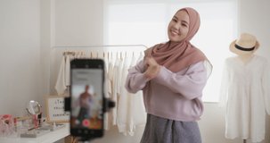 Islam r arab influencer vlogger or beauty blogger live fun dance on social media  reel  app Show share selfie video online trending viral music for asia people Gen Z young girl