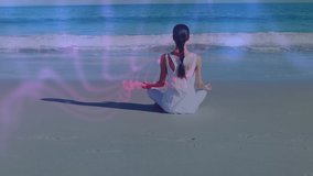 Animation of globe and numbers over caucasian woman meditating at beach. Global sport and digital interface concept digitally generated video.