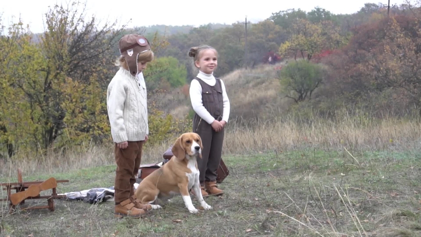 Slow Motion Children and their dog together with plane