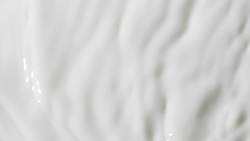 Slow motion white liquid cream ripples, close-up fresh milk drink splash texture | Shutterstock HD Video #1093174045