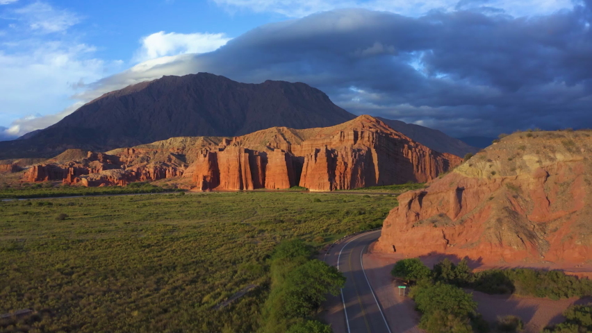 AERIAL - Epic highway and mountains in Cafayate, Salta, Argentina, forward Royalty-Free Stock Footage #1093176041