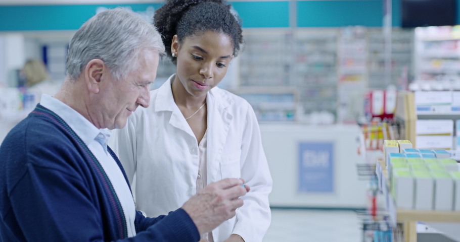 Senior patient talking to pharmacist about medication, asking for help with decision or pharmacy medicine choice. Friendly, trustworthy and smiling medical healthcare professional assisting customer Royalty-Free Stock Footage #1093177001