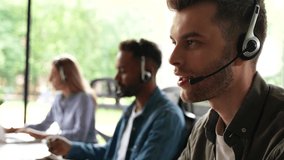 Male representative call center agent in wireless headset helping client, operator working in customer support service - Powered by Shutterstock - Get 15% off with code: PIKWIZARD15