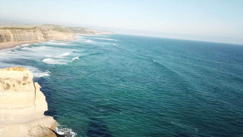 Aerial shot of the Australian twelve apostles natural monument on a sunny day.