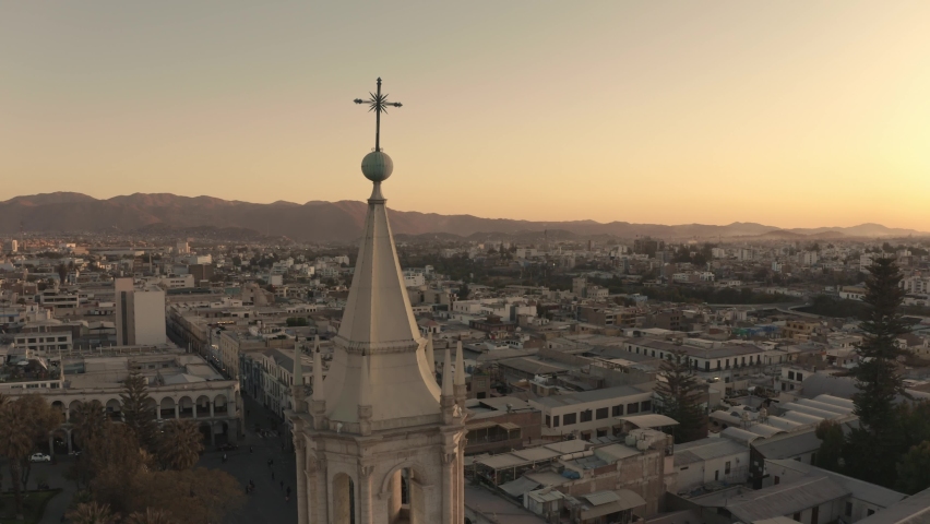 Aerial drone view of Arequipa main square and cathedral church, with the Misti volcano at sunset. Arequipa, Peru.