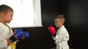 Boys athletes trains paired exercises punches and blocks with hands close-up