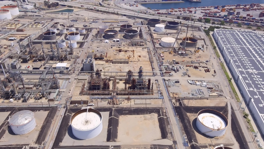 Oil refinery in San Pedro, California tanks, equipment, harbor and smokestack - aerial view