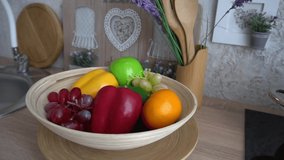 Fresh ripe fruits on kitchen table 