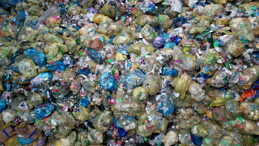 Pile of Trash Bags Awaiting Processing in a Waste Sorting Facility | Shutterstock HD Video #1093217265