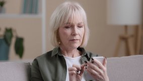 Frustrated senior lady Caucasian elderly woman with phone reads bad news in mobile message feel sad upset shock failure with smartphone app. Worried mature female user customer lost in online - Powered by Shutterstock - Get 15% off with code: PIKWIZARD15