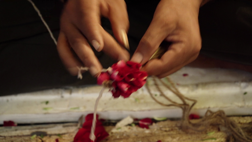 Closeup of a hand making flower garland, Mumbai, India Royalty-Free Stock Footage #1093217935