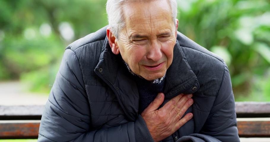 Heart attack, cardiac arrest and chest pain with a senior man suffering from health issues or problems. Mature, elderly and retired male wincing, feeling hurt and sore in his aging body | Shutterstock HD Video #1093218157