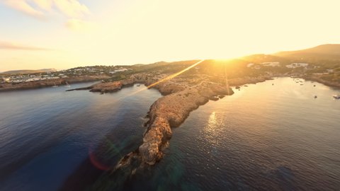 Fpv drone flying around Time and Space spot, in Cala Llentia, Ibiza. July 2022 Redaktionel stock-video
