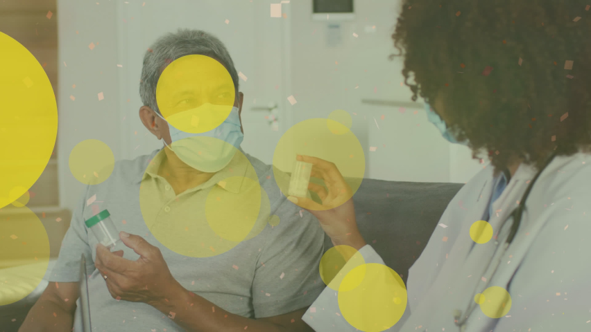 Animation of spots of light over african american female doctor giving medicines to male patient. Medical healthcare and technology concept | Shutterstock HD Video #1093223107