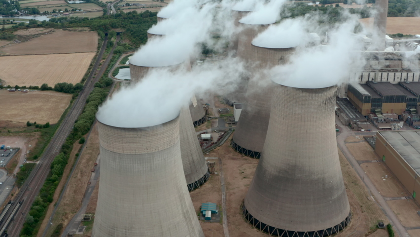 Drone shot over Large power plant cooling towers