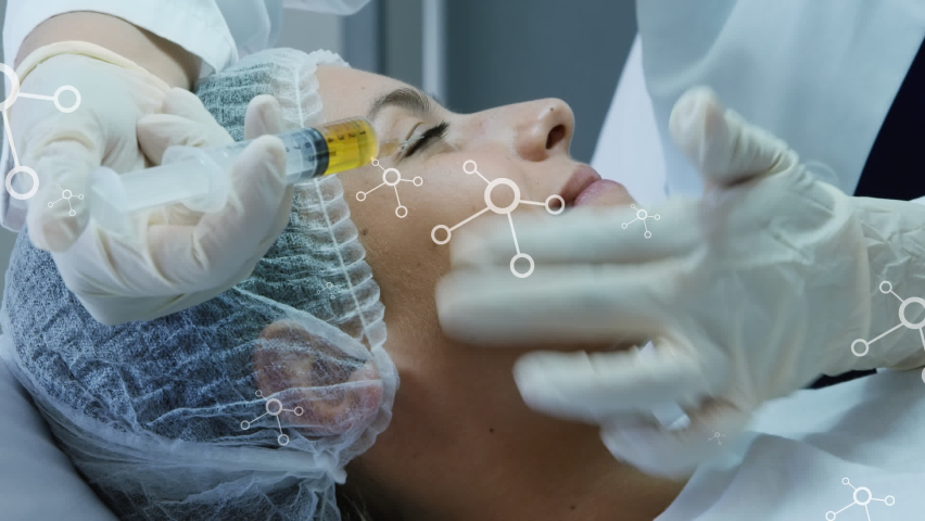 Animation of multiple molecular structures over caucasian woman getting botox treatment on her face. Medical healthcare and technology concept | Shutterstock HD Video #1093227297