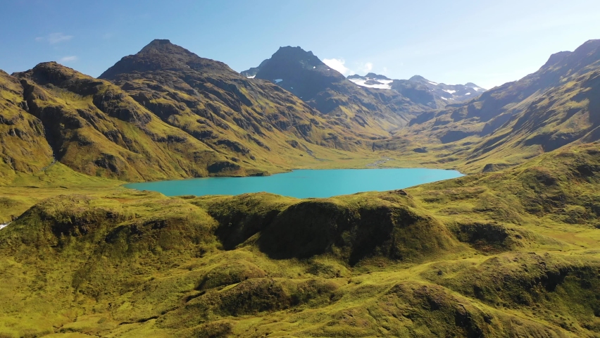 Aerial view of a lake with mountains in background near Dutch Harbour on Unalaska Island, Alaska, United States.