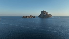 Aerial video of Es Vedra and Es Vedranell islands in Ibiza at sunset.