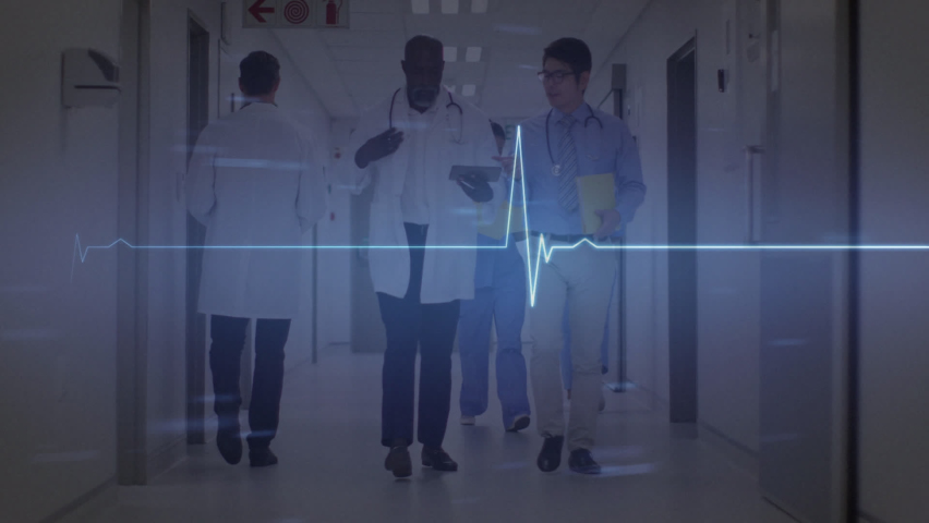Animation of heart rate monitor over two diverse male doctors discussing at hospital. Medical healthcare and technology concept | Shutterstock HD Video #1093235531