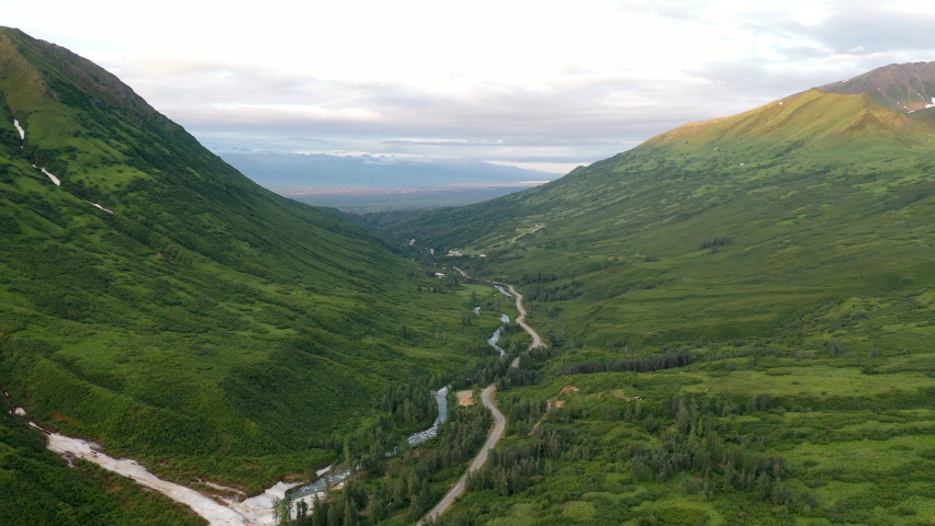 Aerial view of Hatcher Pass, Alaska. Mountain pass through the Talkeetna Mountains from above. Summer Alaskan landscape 