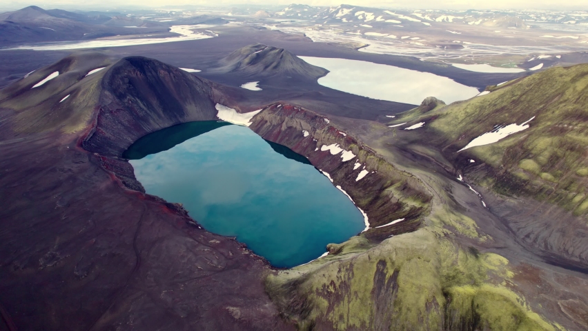 Aerial view of Spectacular Blahylur volcano crater with blue lake in Icelandic highlands on summer at Iceland