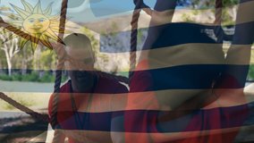 Animation of flag of argentina over caucasian man and boy during obstacle race training. national sports, activity and patriotism concept digitally generated video. - Powered by Shutterstock - Get 15% off with code: PIKWIZARD15