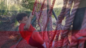 Animation of flag of russina over biracial boy during obstacle race training. national sports, activity and patriotism concept digitally generated video.