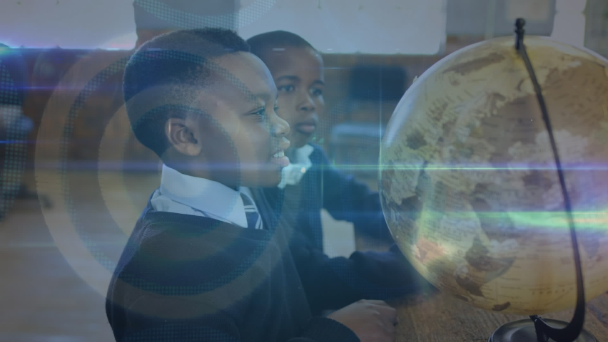 Animation of network of connections with icons over african american pupils with globe at school. learning geography, education, connections and technology concept digitally generated video. | Shutterstock HD Video #1093254033