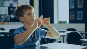 Animation of molecules over caucasian schoolboy in classroom. Global education, science and digital interface concept digitally generated video.