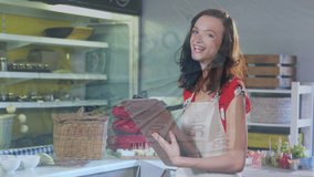 Animation of financial graphs over happy caucasian female seller in grocery shop. economy, finance, shopping and small independent business concept digitally generated video. - Powered by Shutterstock - Get 15% off with code: PIKWIZARD15