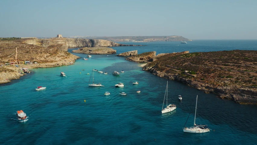 Comino island, Malta. Blue lagoon, summer, boats, blue sea | Shutterstock HD Video #1093274369