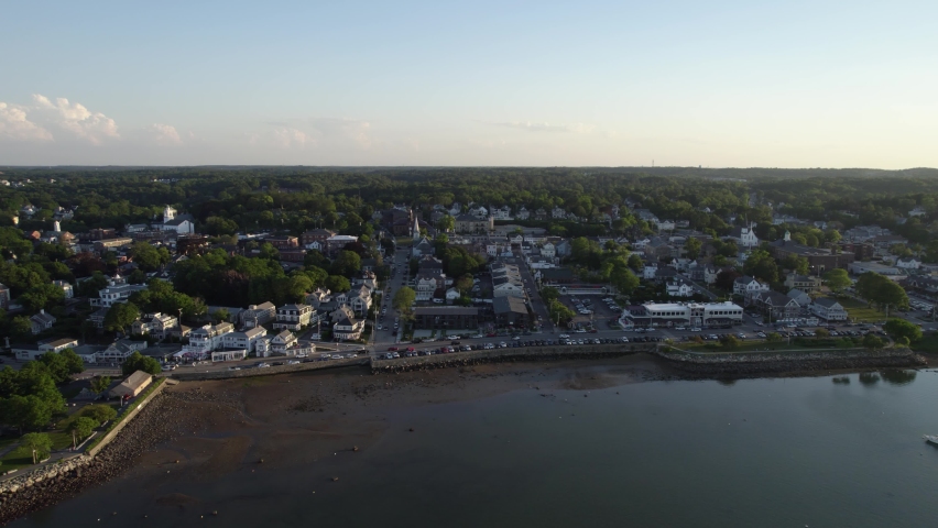 Aerial view over sea, towards the coast of the Plymouth town, summer evening in MA, USA