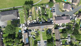 Vertical video, aerial view of traditional UK terraced houses, suburbs and community.