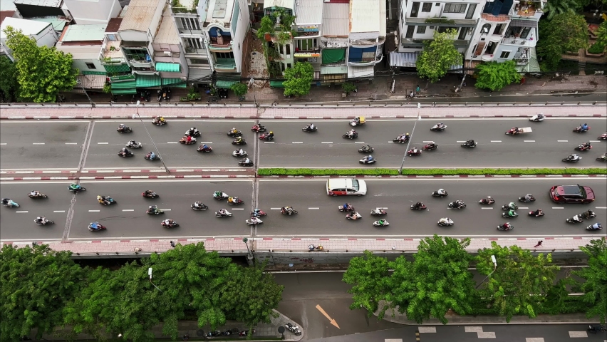 Rush hour in Ho Chi Minh city, Vietnam viewed from above. Lots of scooters commuting.