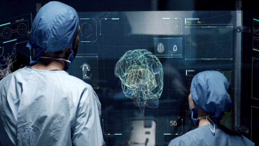 Professional Doctors Analyzing Human Brain Anatomy Scan on Futuristic Touch Screen Interface showing neurons, MRI scans, neural network activity and data. Concept: In the Near Future of Medicine Royalty-Free Stock Footage #1093293223