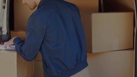 Animation of like text with icons over caucasian delivery man packing boxes. Global shipping, delivery and digital interface concept digitally generated video. - Powered by Shutterstock - Get 15% off with code: PIKWIZARD15