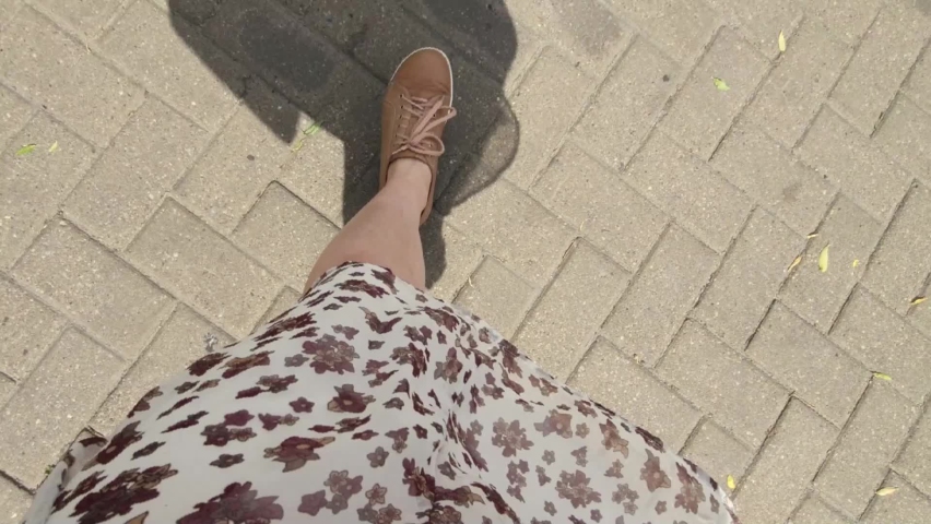 A girl walking on the city, road, stairs.