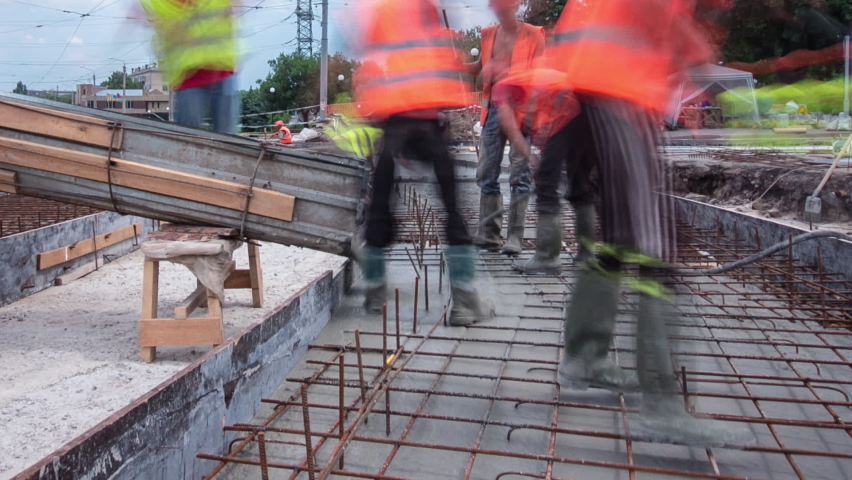 Road construction site with tram tracks repair and maintenance timelapse hyperlapse. Concrete pouring on a middle part of intersection. Replacement of railway tracks for new public transport Royalty-Free Stock Footage #1093309509
